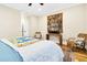 Bright bedroom with two chairs, TV, stylish decor, and natural light to enjoy at 1701 A Palmetto Blvd, Edisto Island, SC 29438