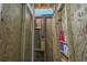 Private outdoor shower with wood accents and shelving at 1701 A Palmetto Blvd, Edisto Island, SC 29438