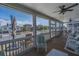 Cozy screened porch with comfortable seating and views of the charming coastal neighborhood at 1701 A Palmetto Blvd, Edisto Island, SC 29438