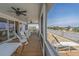 Relaxing screened porch with ample seating, perfect for enjoying the coastal breeze at 1701 A Palmetto Blvd, Edisto Island, SC 29438