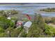 Aesthetic aerial shot of marsh front property boasting dual balconies and luscious surrounding trees at 1801 Landfall Way, Seabrook Island, SC 29455