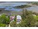 Expansive aerial view showcasing the property's lush green landscaping and proximity to the marsh at 1801 Landfall Way, Seabrook Island, SC 29455