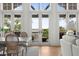 Bright dining area with view of the water from french doors at 1801 Landfall Way, Seabrook Island, SC 29455