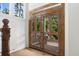 Interior view of ornate wood frame double doors with decorative glass panels at 1801 Landfall Way, Seabrook Island, SC 29455