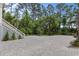 Expansive paved driveway with lush greenery and mature trees at 1801 Landfall Way, Seabrook Island, SC 29455