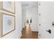 Well-lit hallway featuring hardwood floors and elegant artwork at 1801 Landfall Way, Seabrook Island, SC 29455