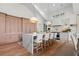 Spacious kitchen island with seating, modern lighting, and custom cabinetry at 1801 Landfall Way, Seabrook Island, SC 29455