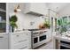 Gourmet kitchen featuring a stainless steel range, subway tile backsplash, and marble countertops at 1801 Landfall Way, Seabrook Island, SC 29455