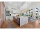 Bright kitchen with a waterfall island, stainless steel appliances, and hardwood floors at 1801 Landfall Way, Seabrook Island, SC 29455