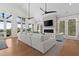Spacious living room with vaulted ceilings, fireplace, and access to an outdoor view at 1801 Landfall Way, Seabrook Island, SC 29455