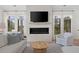 Comfortable living room featuring a fireplace, flatscreen television, and lots of natural light at 1801 Landfall Way, Seabrook Island, SC 29455