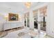 Cozy living room with deck access, modern decor, and bright interior lighting at 1801 Landfall Way, Seabrook Island, SC 29455