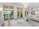 Bright living room features deck access, elegant decor, and view of marsh at 1801 Landfall Way, Seabrook Island, SC 29455