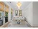 Inviting living room with natural light, deck access, and stylish chandelier at 1801 Landfall Way, Seabrook Island, SC 29455
