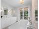 Elegant main bathroom with double vanity, soaking tub, and access to private deck at 1801 Landfall Way, Seabrook Island, SC 29455