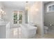 Luxury main bathroom features soaking tub, marble countertops, and private deck at 1801 Landfall Way, Seabrook Island, SC 29455