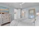 Comfortable bedroom features light blue walls, ceiling fan and white dresser at 1801 Landfall Way, Seabrook Island, SC 29455
