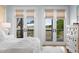 Bright main bedroom boasts private balcony and view of the scenic marsh at 1801 Landfall Way, Seabrook Island, SC 29455