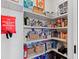 Organized pantry with shelves stocked with food and supplies at 1801 Landfall Way, Seabrook Island, SC 29455