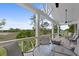 Inviting outdoor porch area with comfortable seating and serene water views at 1801 Landfall Way, Seabrook Island, SC 29455