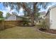 A large backyard with a mature tree, well-maintained lawn, and an inviting outdoor space at 1817 Towne St, Johns Island, SC 29455