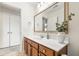 Bright bathroom featuring a vanity with sink, a large mirror, and neutral decor at 1817 Towne St, Johns Island, SC 29455