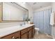 Bathroom featuring a large mirror, vanity with storage, and a shower with a decorative curtain at 1817 Towne St, Johns Island, SC 29455