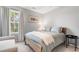 This bedroom features a cozy bed, a sunlit window with a view, and a soothing color palette at 1817 Towne St, Johns Island, SC 29455