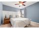 Inviting bedroom with ceiling fan, a cozy bed, bedside table, and natural light from the window at 1817 Towne St, Johns Island, SC 29455