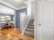 Inviting entryway with hardwood floors, staircase, and view into the dining room at 1817 Towne St, Johns Island, SC 29455