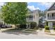 Charming two-story home featuring a covered porch, well-maintained landscaping, and ample parking on a sunny day at 1817 Towne St, Johns Island, SC 29455