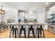 Spacious kitchen featuring a large island with seating, stainless steel appliances, and white cabinetry at 1817 Towne St, Johns Island, SC 29455