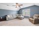 Upstairs bonus room with sectional, ceiling fan and plenty of room to relax or entertain at 1817 Towne St, Johns Island, SC 29455
