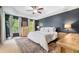 Bedroom features a tray ceiling, a wood accent wall and ample natural light at 1817 Towne St, Johns Island, SC 29455