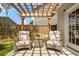 Inviting patio featuring a pergola, comfortable seating, and a charming outdoor setting at 1817 Towne St, Johns Island, SC 29455