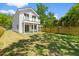 Spacious backyard featuring a well-maintained lawn, white siding, and a charming balcony at 1917 Jason St, North Charleston, SC 29406