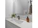 Modern bathroom with a bright mirror, quartz countertop, dark faucet, and a clean, white sink at 1917 Jason St, North Charleston, SC 29406