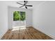 Bright bedroom features wood floors, a ceiling fan, and sliding glass doors to a balcony at 1917 Jason St, North Charleston, SC 29406