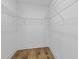Walk-in closet offers wire shelving and hardwood floors for efficient storage in a modern home at 1917 Jason St, North Charleston, SC 29406
