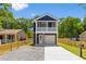 Charming two-story home with a modern exterior and manicured front yard and driveway at 1917 Jason St, North Charleston, SC 29406