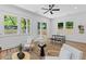 Bright living area featuring modern decor, light wood floors, and a sliding glass door for seamless indoor-outdoor living at 1917 Jason St, North Charleston, SC 29406