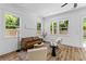 Cozy living space with a neutral-toned decor and large windows for plenty of natural light at 1917 Jason St, North Charleston, SC 29406