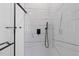 Modern shower with glass enclosure, black hardware, and marble-style tile for a luxurious bathing experience at 1917 Jason St, North Charleston, SC 29406