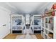 Shared bedroom with symmetrical bunk beds, playful décor, and hardwood floors at 2 Piedmont Ave # A, Charleston, SC 29403