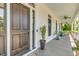 Home featuring a welcoming entrance and a charming front porch at 2 Piedmont Ave # A, Charleston, SC 29403