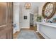 Warm entryway featuring hardwood floors, decorative accents, and a view of the living spaces at 2 Piedmont Ave # A, Charleston, SC 29403