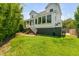Backyard view of a two-story home with a porch and a well-manicured lawn at 2 Piedmont Ave # A, Charleston, SC 29403