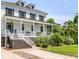 Classic two-story home with a charming front porch, detailed trim, and professionally landscaped yard at 2 Piedmont Ave # A, Charleston, SC 29403