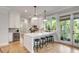 This gourmet kitchen is outfitted with a wine fridge, granite countertops, barstool seating and lots of natural light at 2 Piedmont Ave # A, Charleston, SC 29403