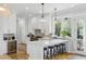 Modern kitchen with stainless steel appliances, breakfast bar, and ample natural light at 2 Piedmont Ave # A, Charleston, SC 29403